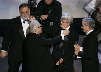 4 of the Top 100 in one picture: Martin Scorsese receiving his Oscar from three close friends: Francis Ford Coppola, George Lucas and Steven Spielberg